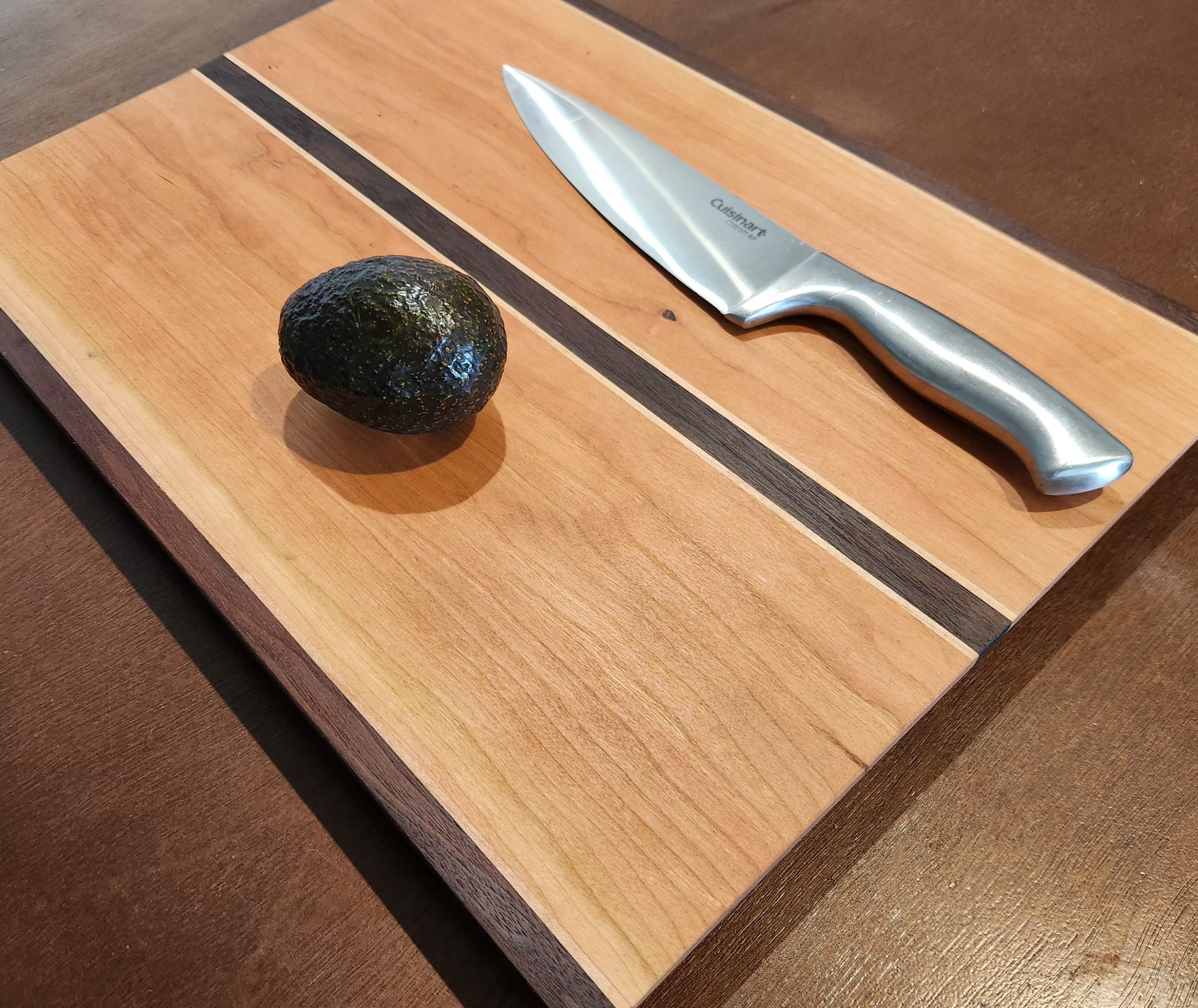 cutting board with avocado and knife