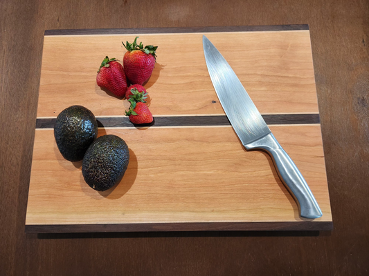 cutting board with fruit and knife